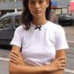 Caro Editions' new signature line in jersey cotton.  The Caro T-shirt is a fitted style with short sleeves, a ribbon bow detail at the front, and embroidered Caro Editions logo on the back.   Also available in Red White stripe, and Black White stripe.  Style the Caro T-shirt under shirts or dresses, or wear them on their own.  Material: 95% cotton, 5% elastane. Bow: 100% Polyester.  The model is 175cm (5'9") and is wearing a size S.