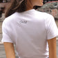 Caro Editions' new signature line in jersey cotton.  The Caro T-shirt is a fitted style with short sleeves, a ribbon bow detail at the front, and embroidered Caro Editions logo on the back.   Also available in Red White stripe, and Black White stripe.  Style the Caro T-shirt under shirts or dresses, or wear them on their own.  Material: 95% cotton, 5% elastane. Bow: 100% Polyester.  The model is 175cm (5'9") and is wearing a size S.