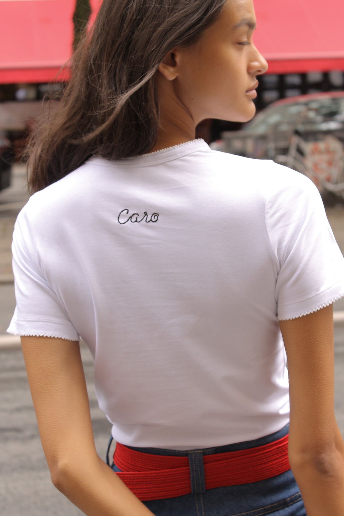 Caro Editions' new signature line in jersey cotton.  The Caro T-shirt is a fitted style with short sleeves, a ribbon bow detail at the front, and embroidered Caro Editions logo on the back.   Also available in Red White stripe, and Black White stripe.  Style the Caro T-shirt under shirts or dresses, or wear them on their own.  Material: 95% cotton, 5% elastane. Bow: 100% Polyester.  The model is 175cm (5'9") and is wearing a size S.