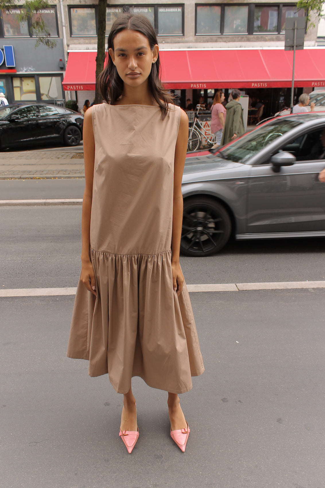 The Sonya Dress is an oversized style with a high neckline and low back featuring a large bow detail. The dress is made in crispy cotton poplin. Style it with an open shirt or denim jacket.  Also available in Navy Flower Poplin, White Flower Poplin, Beaded Emerald Silk Velvet, White Daisy Silk, and Black Silk Velvet.  Material: 100% cotton.  The model is 175cm (5'9") and is wearing a size S.