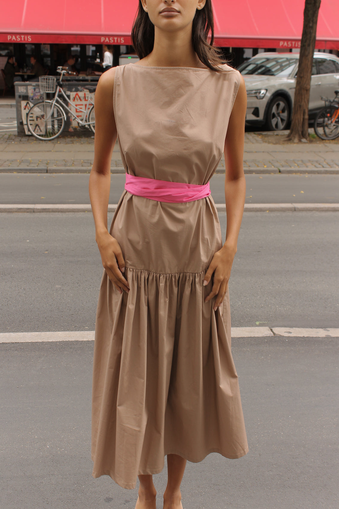 The Sonya Dress is an oversized style with a high neckline and low back featuring a large bow detail. The dress is made in crispy cotton poplin. Style it with an open shirt or denim jacket.  Also available in Navy Flower Poplin, White Flower Poplin, Beaded Emerald Silk Velvet, White Daisy Silk, and Black Silk Velvet.  Material: 100% cotton.  The model is 175cm (5'9") and is wearing a size S.