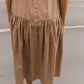 The Sonya Dress is an oversized style with a high neckline and low back featuring a large bow detail. The dress is made in crispy cotton poplin. Style it with an open shirt or denim jacket.  Also available in Navy Flower Poplin, White Flower Poplin, Beaded Emerald Silk Velvet, White Daisy Silk, and Black Silk Velvet.  Material: 100% cotton.  The model is 175cm (5'9") and is wearing a size S.