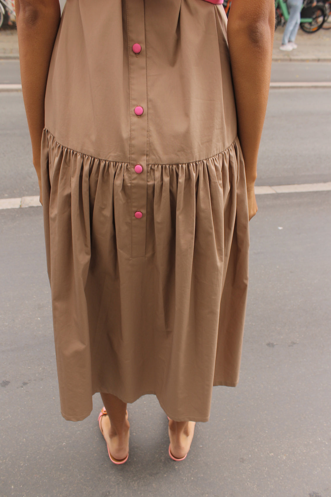 The Sonya Dress is an oversized style with a high neckline and low back featuring a large bow detail. The dress is made in crispy cotton poplin. Style it with an open shirt or denim jacket.  Also available in Navy Flower Poplin, White Flower Poplin, Beaded Emerald Silk Velvet, White Daisy Silk, and Black Silk Velvet.  Material: 100% cotton.  The model is 175cm (5'9") and is wearing a size S.