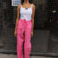 The Hannah Pants are loose-fitted cotton poplin pants. The pants feature back pockets and cargo details on the side.  Style them with the matching Hannah Pants or a classic t-shirt.  Also available in Bottle Green, Navy, Kahki, Navy Flower and White Flower.  Material: 100% cotton.  The model is 175cm (5'9") and is wearing a size S.
