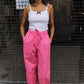 The Hannah Pants are loose-fitted cotton poplin pants. The pants feature back pockets and cargo details on the side.  Style them with the matching Hannah Pants or a classic t-shirt.  Also available in Bottle Green, Navy, Kahki, Navy Flower and White Flower.  Material: 100% cotton.  The model is 175cm (5'9") and is wearing a size S.