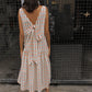 The Sonya Dress is an oversized style with a high neckline and low back featuring a large bow detail. The dress is made in crispy cotton poplin. Style it with an open shirt or denim jacket.  Also available in Navy Flower Poplin, Khaki Poplin, Beaded Emerald Silk Velvet, White Daisy Silk, and Black Silk Velvet.  Material: 100% cotton.  The model is 175cm (5'9") and is wearing a size S.