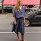 The Amanda Dress in Navy Crisp Cotton Poplin with an elastic waistband.   Material: 100% cotton.  The model is 179cm (5'10") and is wearing a size S.