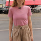 The Hannah shorts are loose-fitted poplin-style shorts with an elastic band, pockets, and cargo details.  Style it with a matching Hannah Shirt or a T-shirt.  Also available in Navy Flower Poplin, White Flower Poplin, and Pink.  Material: 100% cotton.  The model is 175cm (5'9") and is wearing a size S.